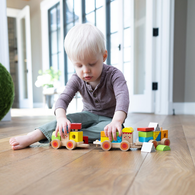 Baby boy playing best sale toys